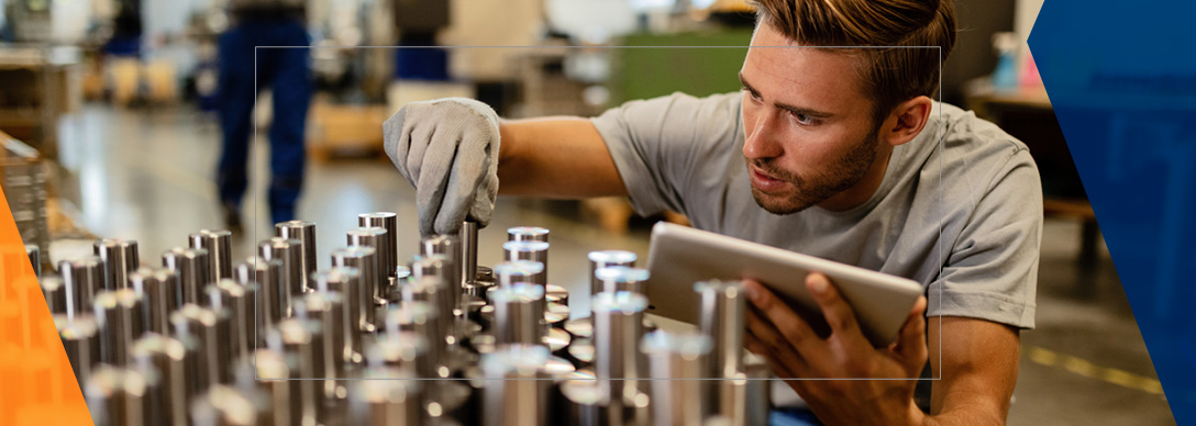 A man looks at specimens from the ASTM B117 test